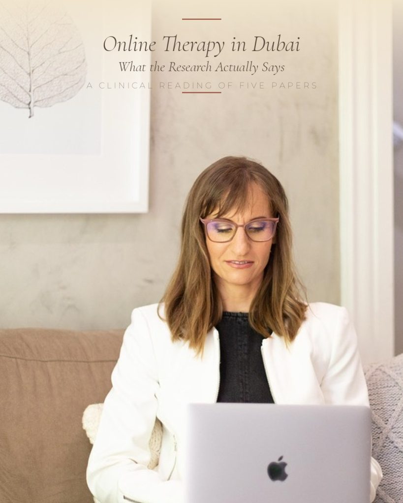 Online therapy Dubai — clinical psychologist Christi Gadd at her laptop.
