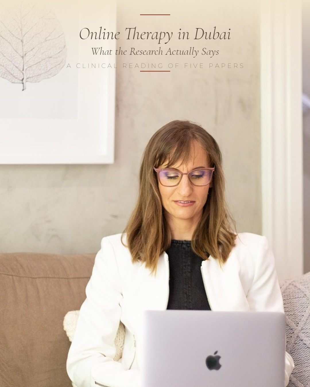 Online therapy Dubai — clinical psychologist Christi Gadd at her laptop.